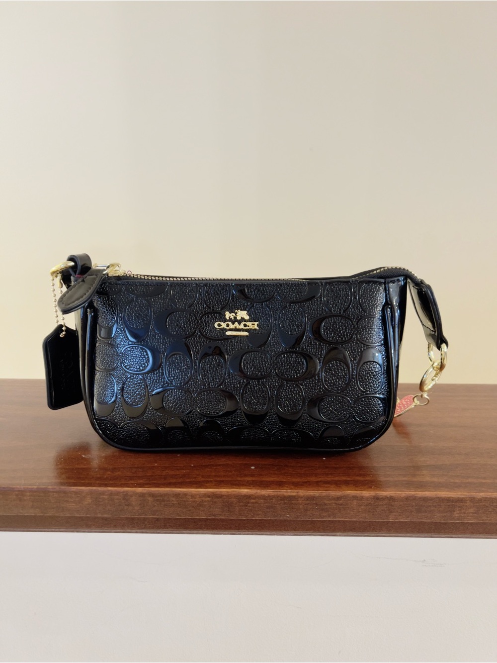 Black Patent Shoulder Bag with Gold Crescent Charm Accent